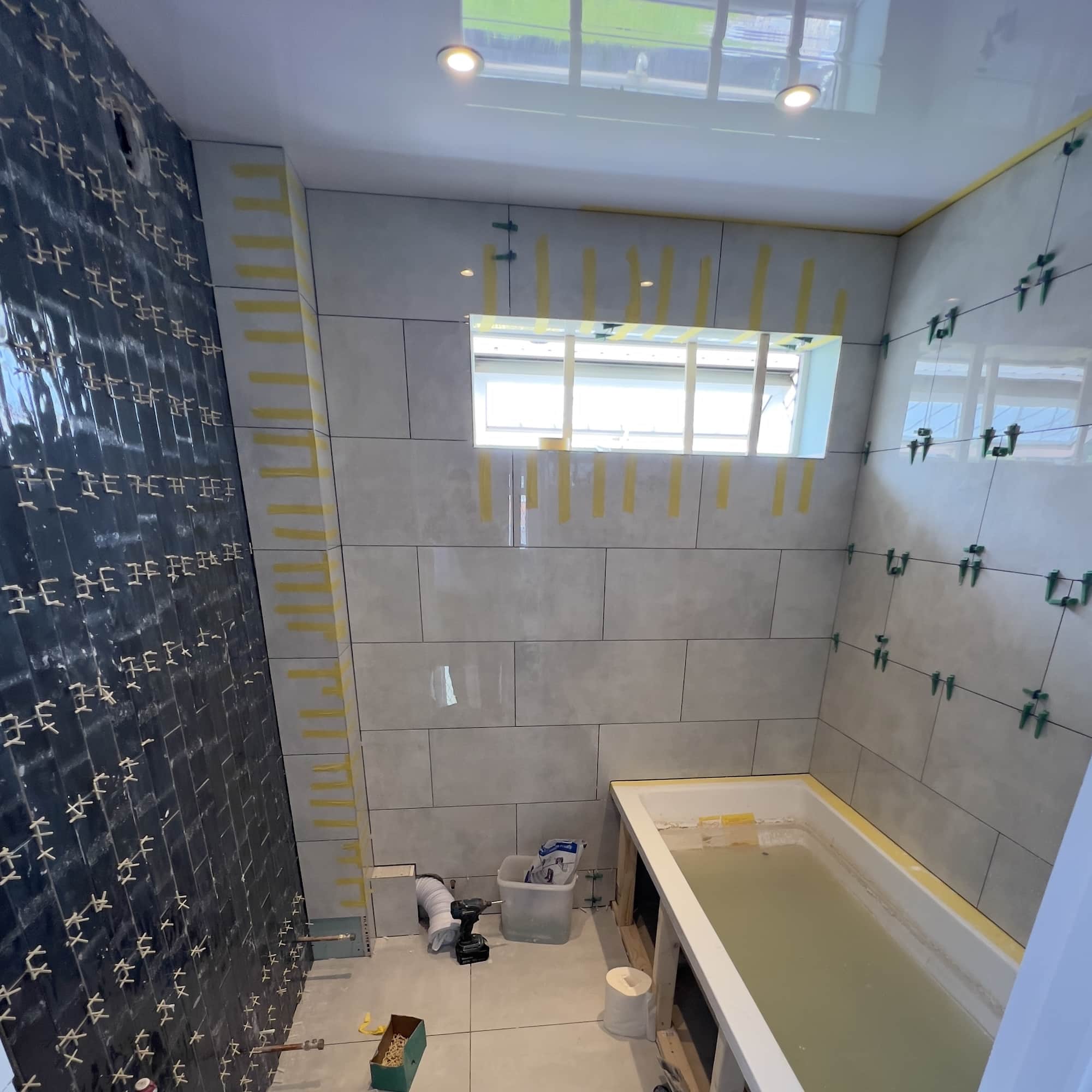 Bathroom ceiling installation and tiling
